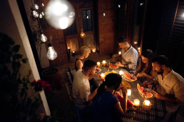 istock Couples having a serene time together during dinner party 1369801451