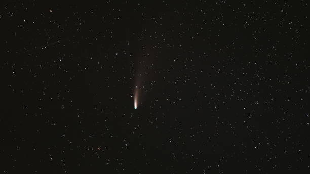 istock 18 July 2020. Comet Neowise C2020F3 In Night Starry Sky. Natural Night Sky Background. 4K Time lapse 1369802450