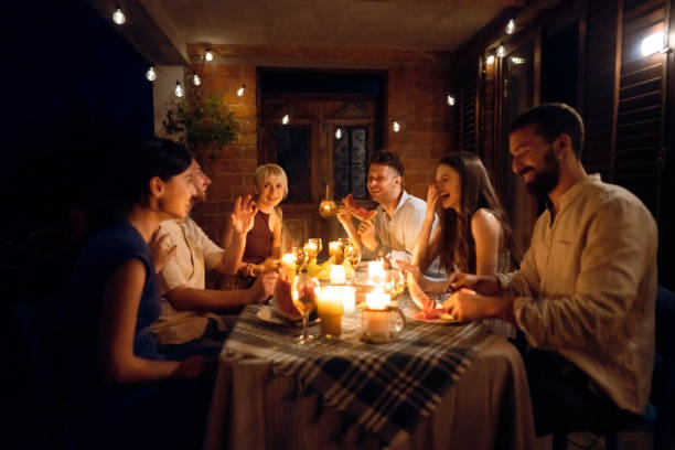 istock Joyful Caucasian couples having a serene time together during dinner party 1369802576