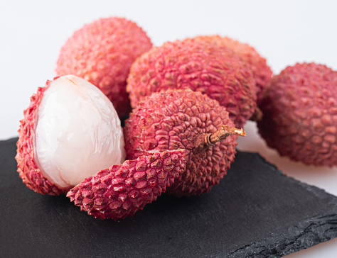 Fresh Mangosteen Fruit On A Reflective Black Surface. More Mangosteen Related Photos: