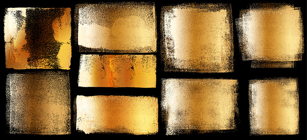 Set of golden grunge design elements on black background isolated.