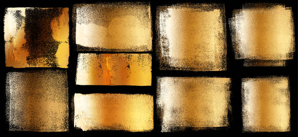 Golden grunge brushes Set of golden grunge design elements on black background isolated. gilded stock illustrations
