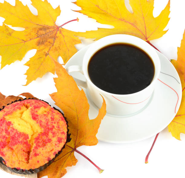 istock Cup of coffee,muffin and yellow maple leaf isolated on white 1369805284