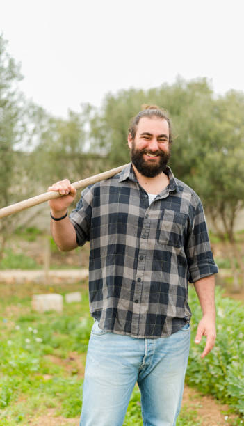 istock Bearded man with axe in countryside 1369806045