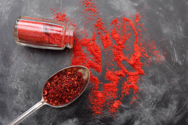 istock Paprika and tomato spice on the kitchen table, top view 1369807820