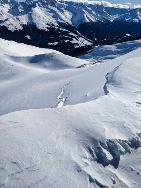 istock large avalanche crack edge. gliding snow avalanches. avalanche in winter. Davos 1369808209