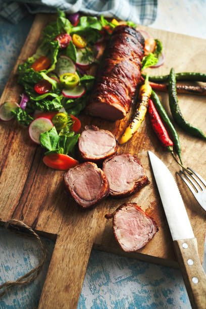 istock Roasted Pork Filet with Bacon and Green Salad 1369809078