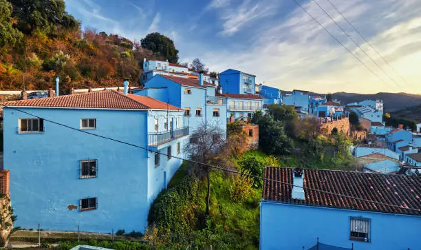 Picturesque hillside famous Juzcar town or Smurfs Village, all residential houses painted blue color. Landmarks and travel destination. Valle del Genal, Serrania de Ronda, Malaga. Andalusia, Spain