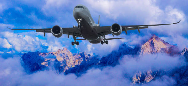istock Plane in Front of Alps 1369812267