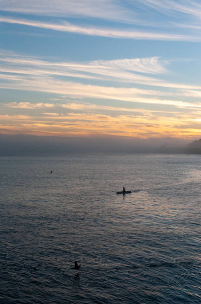 istock Solitary Canoer at sunset 1369812752