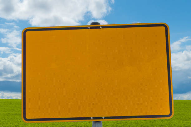 istock Yellow Sign in Front of Landscape 1369812976