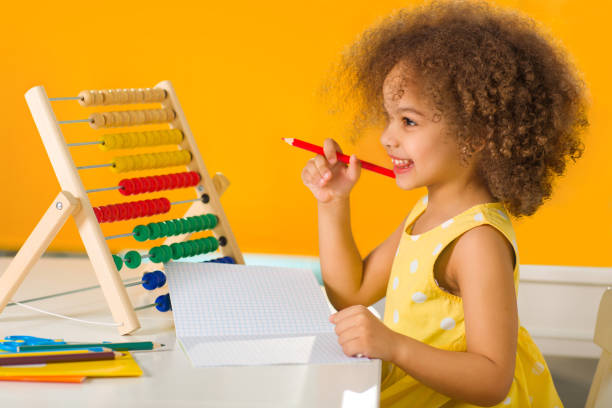 istock A Black African-American girl is ready for a math and arithmetic lesson with 1369813068