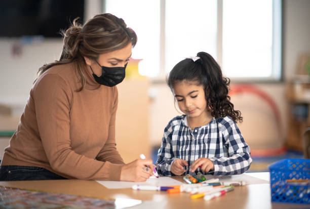 istock Coloring with the Teacher 1369815996