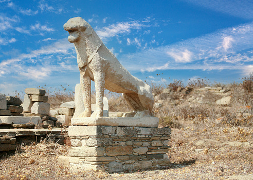 The island of Delos, recognised as the birthplace of the god Apollo.  Today it is one of the most important archaeological sights in Greece and is covered in excavations, one of which is the famous Terrace of the Lions. This terrace was erected and dedicated to Apollo by the people of Naxos.