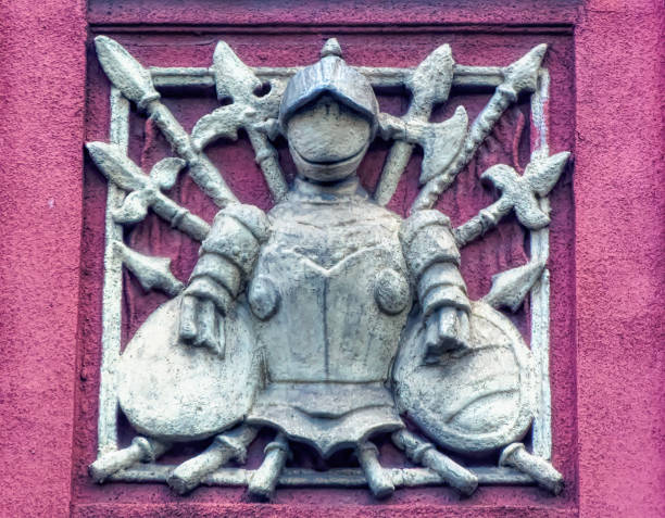 istock Medieval armor with weapons as facade decoration in Sarajevo. 1369826730