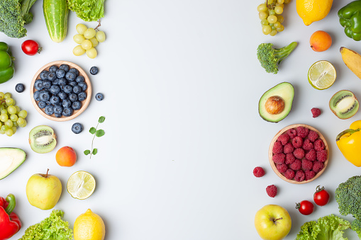 Fresh fruits and vegetables on grey background. Healthy eating concept. Flat lay, copy space.