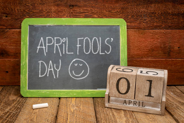 April Fools Day - slate blackboard with wooden calendar stock photo