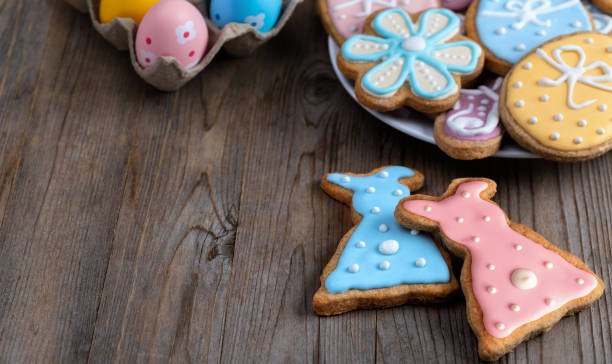 istock Easter bunny and eggs on wooden background. 1369835901