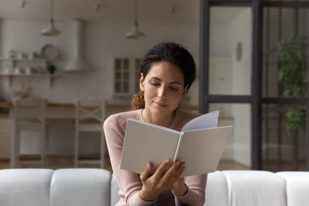 istock Caucasian woman relax at home reading book 1369837951