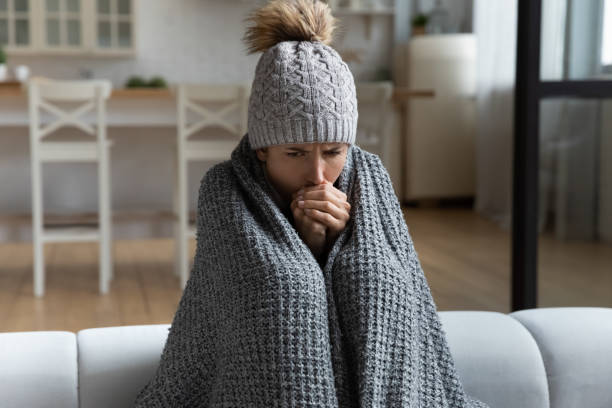 istock Unwell woman feel cold in home with no heating 1369837953