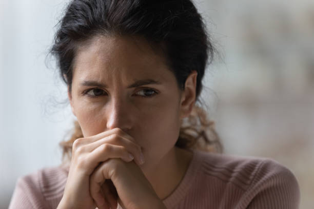 istock Sad young woman look in distance thinking 1369837964