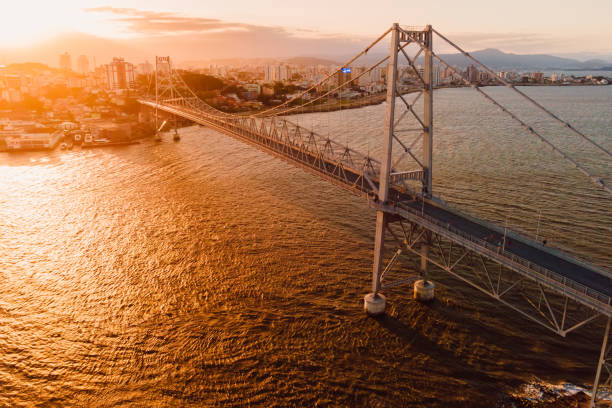 The sunset at the Herlicio Luz Bridge. Iron bridge in Florianopolis