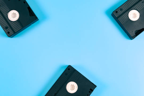 istock Three retro videotapes lie on the sides against a blue 1369846681