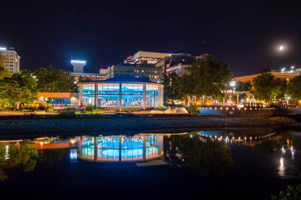 The Looff carousel all illuminated at night on the Spokane River in Riverfront Park, Spokane Washington, USA, during an annual fair celebration. The Looff carousel all illuminated at night on the Spokane River in Riverfront Park, Spokane Washington, USA, during an annual fair celebration. spokane river stock pictures, royalty-free photos & images