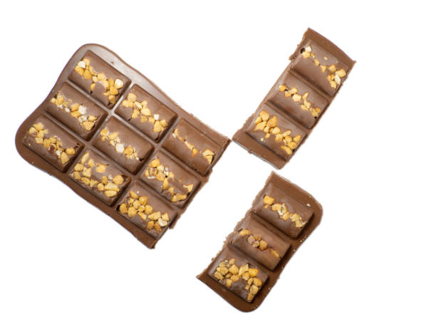 istock Milk chocolate bar with nuts on a white background. 1369852114