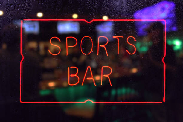 istock Neon Sports Bar Sign, Rainy Window Blur Image 1369853594