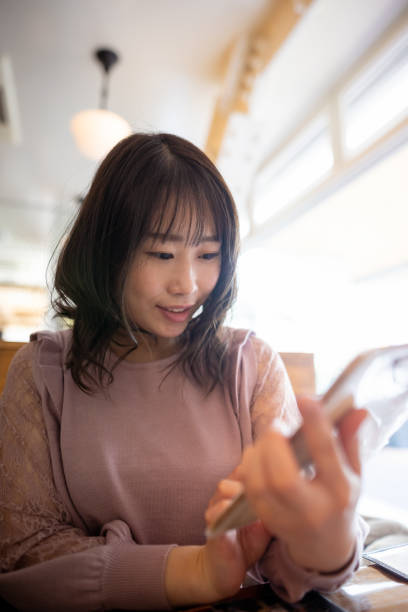istock Woman looking at menu for lunch in restaurant 1369855557