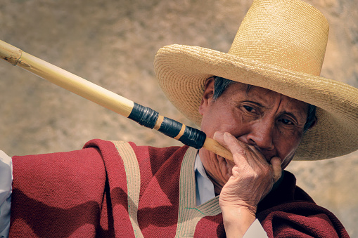 Cajamarca, Peru - june 10, 2018: musician playing the clarin of Cajamarca
