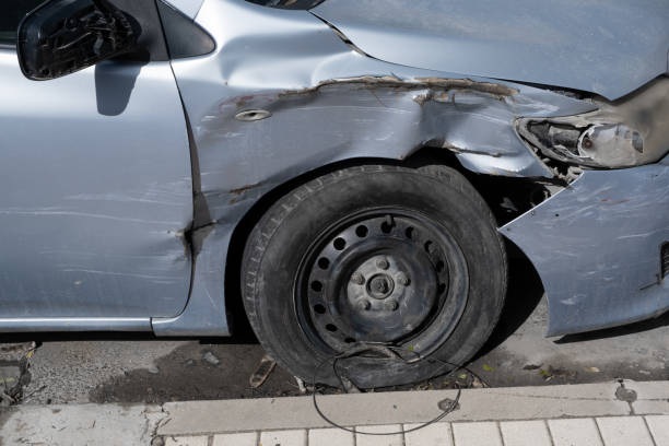 istock Dented Car side. Transport Accident Crashed metall on private car. Car insurance concept. Blue Metallic color 1369857205
