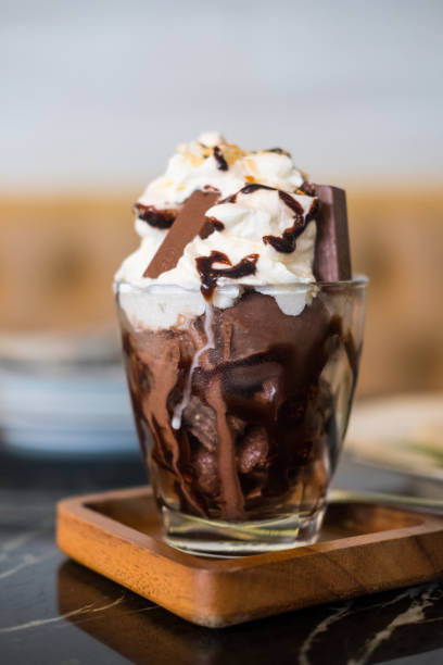 istock Chocolate ice cream with whipped cream  and chocolate sauce 1369862867