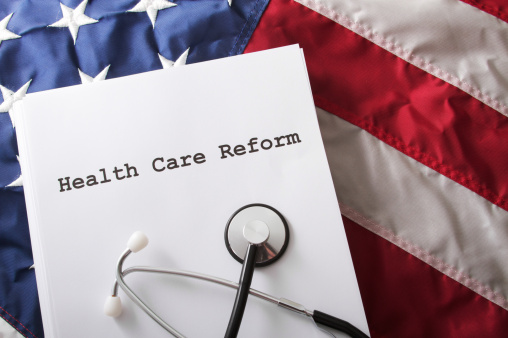 Health care reform bill / law on an American flag.