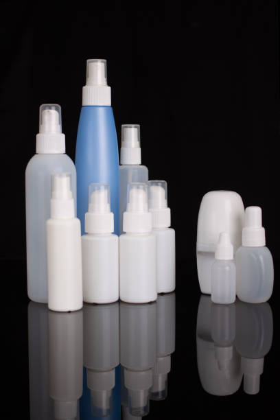 istock set of cosmetic bottles isolated on black background, blank packaging 1369869459