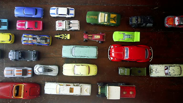 Retro toy cars on an old wooden floor stop motion loop