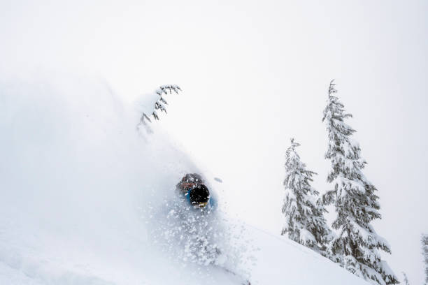 istock Male backcountry snowboarding fresh powder 1369872387