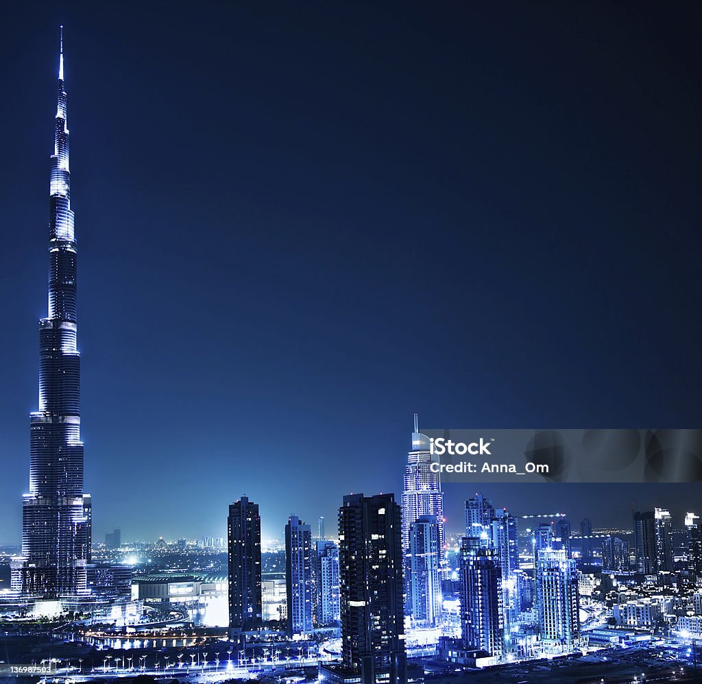 Dubai downtown at night Dubai downtown night scene with city lights, luxury new high tech town in middle East, United Arab Emirates architecture Architecture Stock Photo