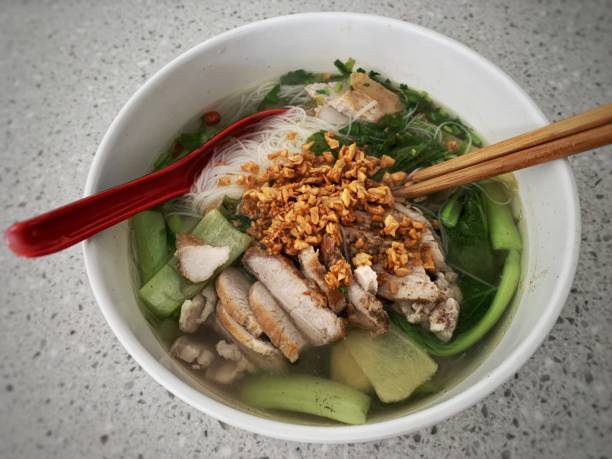 istock Delicious home made noodle soup with fried garlic, vegetable and fried pork 1369879072