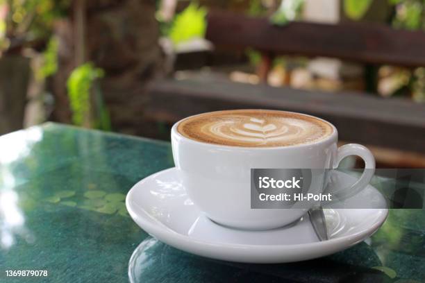 Single Cup Of Coffee On A Garden Table Stock Photo - Download Image Now - Cappuccino, Froth Art, Plant