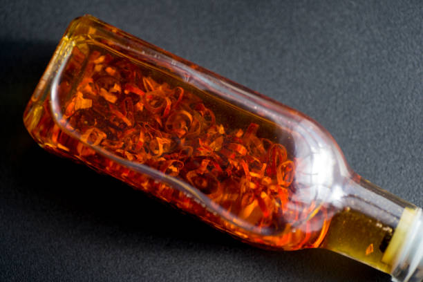 istock Olive oil in which chili peppers are pickled 1369881592