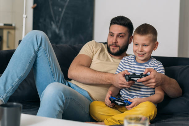 istock father and son at home 1369887638