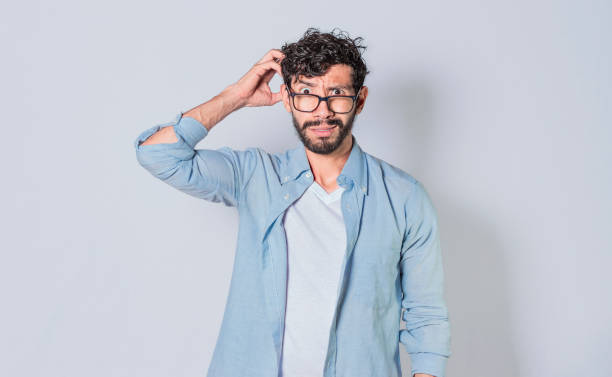 istock Confused man scratching his head, guy scratching his head puzzled 1369887953