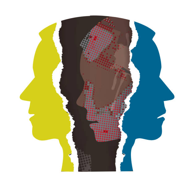 istock Schizophrenia, manic depression, male head silhouettes on torn paper. 1369888645