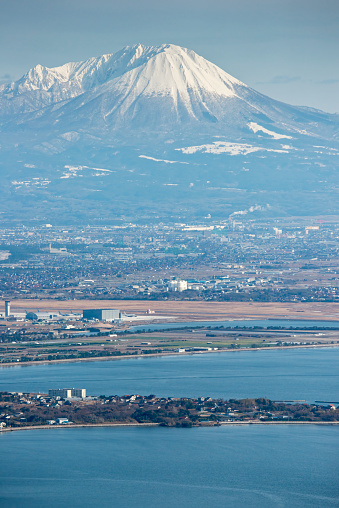 Snow-covered Mt. Daisen rises over the Nakaumi Sea.