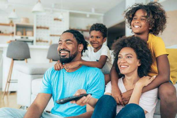 istock Family watching television 1369891096