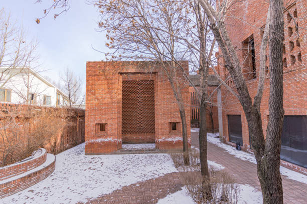 istock Red brick garden in winter snow 1369891184