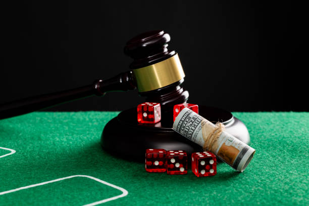istock Gavel and red dices on the table 1369892574