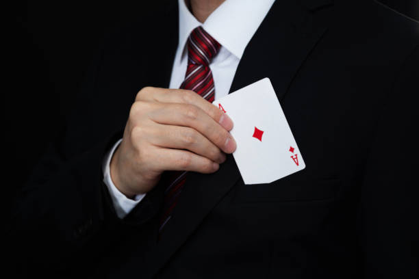 businessman pull an ace out of pocket - karo ası stok fotoğraflar ve resimler